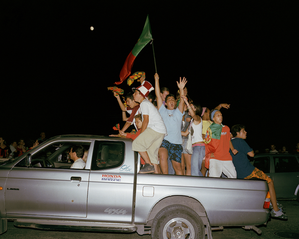 Portugal fans celebrate reaching the final of Euro 2004 after beating the Netherlands. © Neil Massey