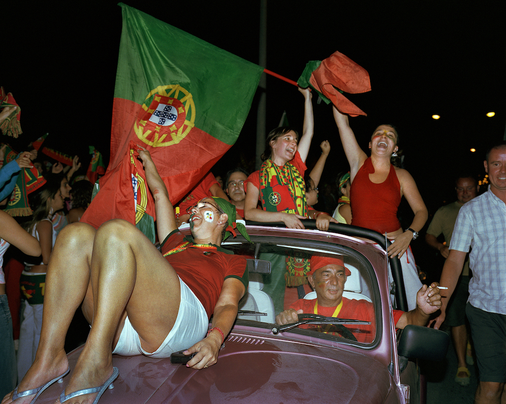 Portugal fans celebrate reaching the final of Euro 2004 after beating the Netherlands. © Neil Massey