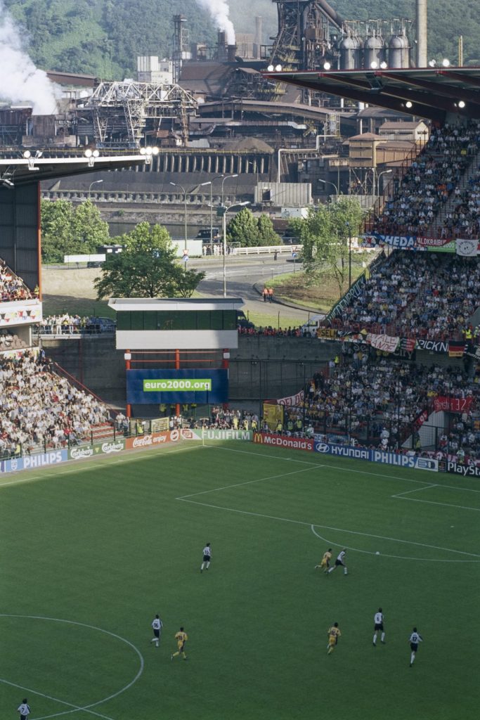 'European Championship: Germany v Romania, Stade Maurice Dufrasne, Liege, Belgium 12 June 2000'. Copyright Peter Robinson. Courtesy OOF Gallery
