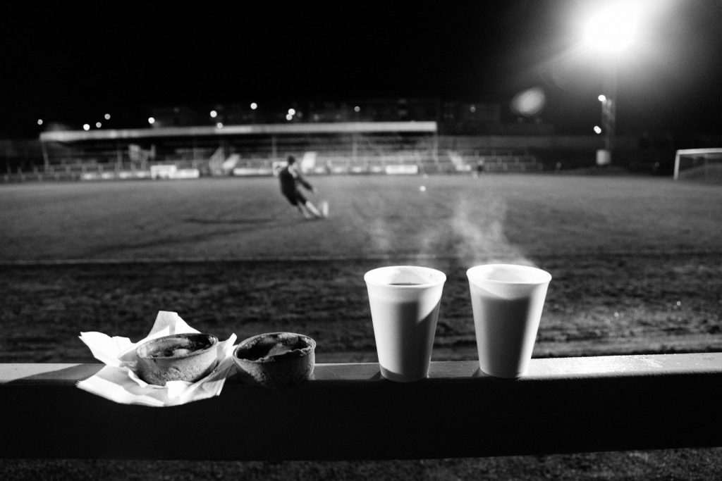 Half time pie and Bovril on a cold Scottish January night. Albion Rovers v Queens Park, Cliftonhill Stadium. Archival Giclée print with a pearl finish, unframed. Iain McLean