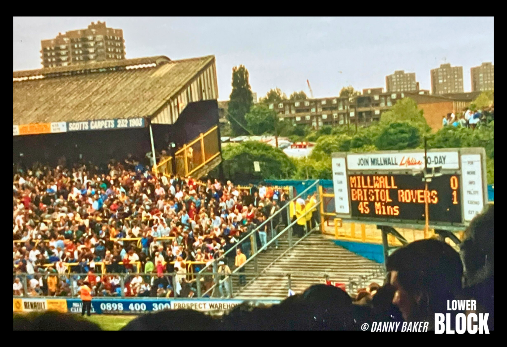 Danny Baker is a Deptford-born Millwall supporter who has spent his career as a comedy writer, journalist, radio DJ, and screenwriter, later becoming a well-known Radio 5 presenter.

These photos are from May 8, 1993, at The Den, when Millwall lost 3–0 to Bristol Rovers. They’re shared by someone who was simply there, following his club, camera in hand. No statement, no drama — just a moment from the football life that sat alongside his wider work in media.