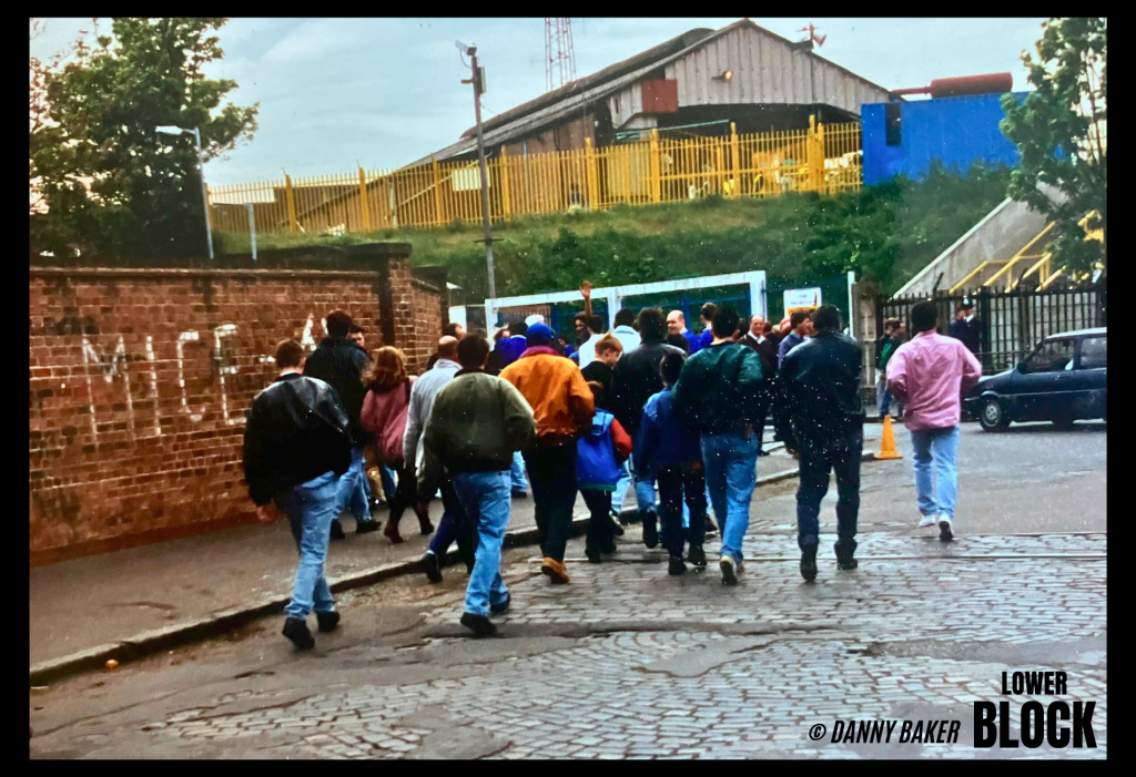 Danny Baker is a Deptford-born Millwall supporter who has spent his career as a comedy writer, journalist, radio DJ, and screenwriter, later becoming a well-known Radio 5 presenter.

These photos are from May 8, 1993, at The Den, when Millwall lost 3–0 to Bristol Rovers. They’re shared by someone who was simply there, following his club, camera in hand. No statement, no drama — just a moment from the football life that sat alongside his wider work in media.
