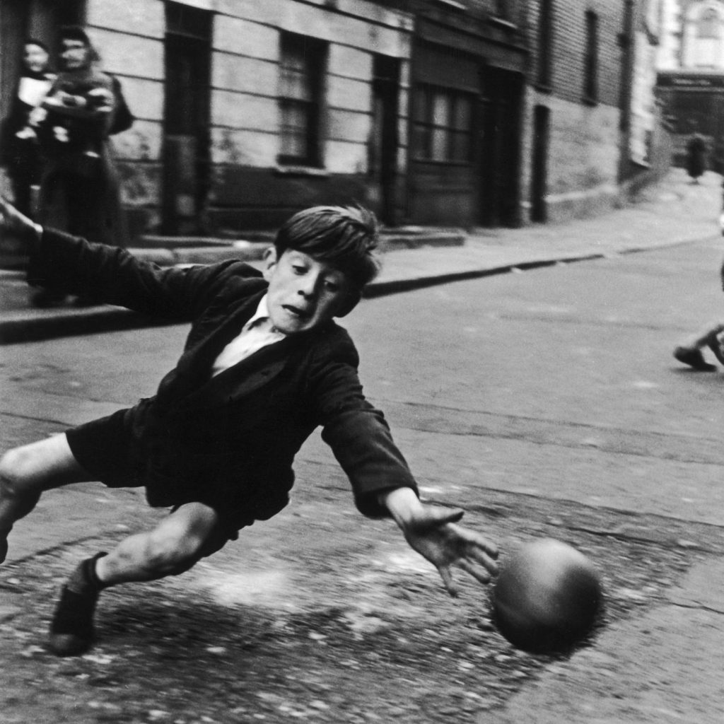 Boy playing street football_ the goalie, 1956. © Roger Mayne Archive _ Mary Evans Picture Library. Courtesy OOF Gallery