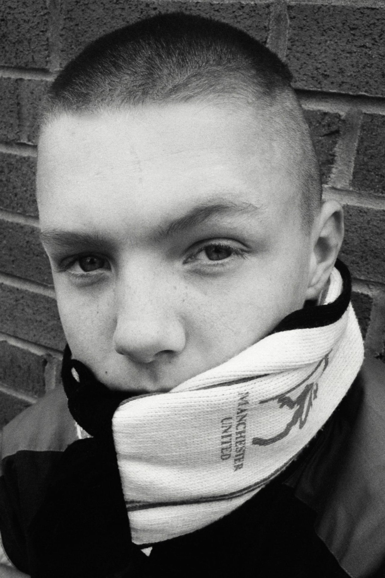 Manchester United fan outside Old Trafford, 1991. Lower Block Edition Going to the Match © Richard Davis