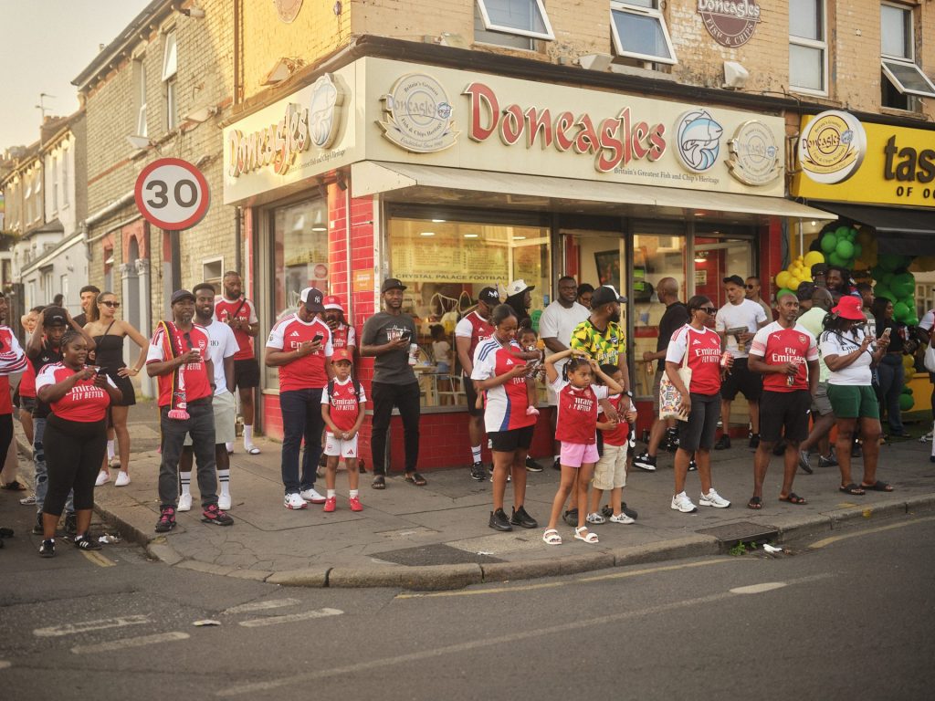 Arsenal fans celebrate becoming Champions away at Selhurst Park © Orlando Gili