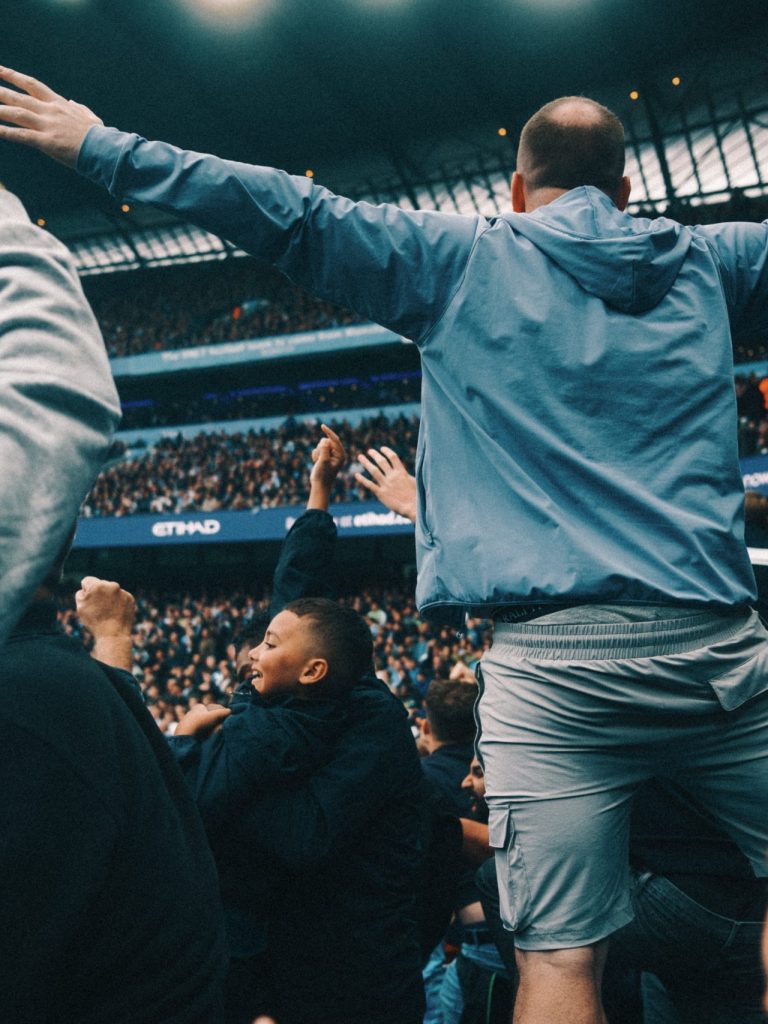 in the madness a dad enjoying the moment with his son, Arsenal Away at Man City